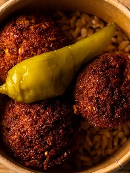 A close-up of crispy falafel balls, showing the texture and color. This macro shot is perfect for highlighting a key ingredient.