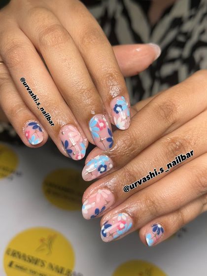 This fun and artsy set features abstract, layered florals in bold blues and pinks. The hand-painted style gives it a fresh, playful personality perfect for someone who loves color.