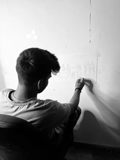 A photo of me working on the sketch. For me, art is a process of faith and memory.