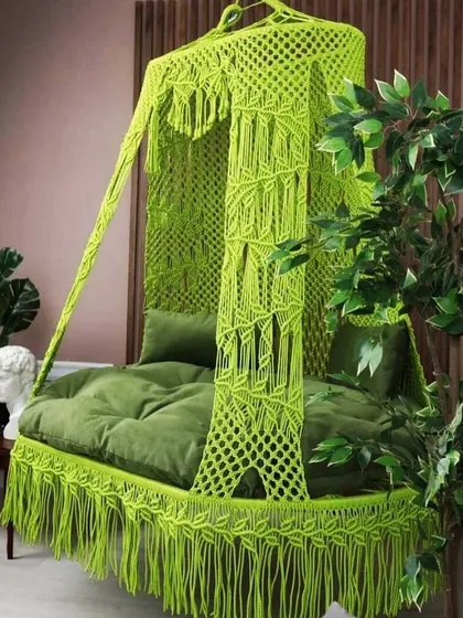 This square-shaped sofa swing in a vibrant lime green is a unique and modern take on the classic jhula. It's perfect for adding a fun and stylish touch to your balcony or room.