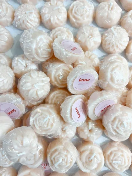 A big batch of our flower-shaped wax melts, individually wrapped and ready to go.