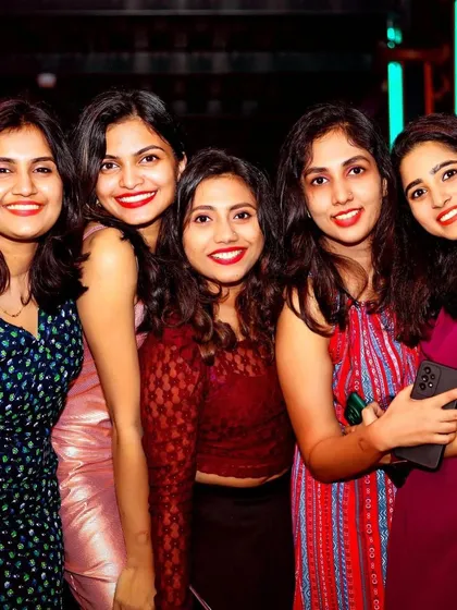 A group of ladies looking glamorous and ready to dance the night away.