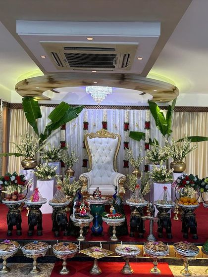 A full frontal view of the elegant stage with banana plants.