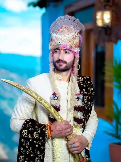 A Himachali groom in his traditional attire is a sight to behold. I focus on capturing the pride and regality of the moment, from the detailed turban to the ceremonial sword.