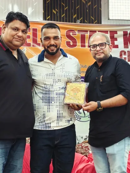 Receiving an award for my team's performance at the Delhi State Kickboxing Championship.