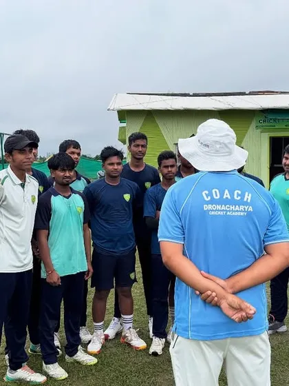 The coach's perspective. Here, our head coach addresses the team, ensuring every player is aligned and focused. This is where individual talents are molded into a cohesive, winning unit.