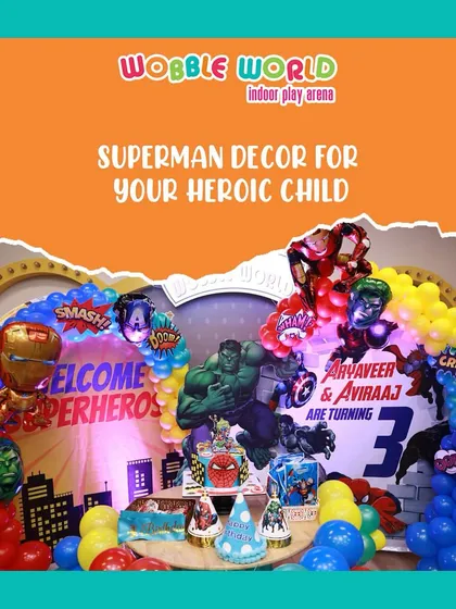 A closer look at the superhero decor, highlighting the dynamic backdrop with Hulk, Iron Man, and Captain America, perfect for a heroic child's party.