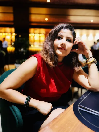 A portrait shot from a dinner outing, capturing a moment of self-reflection and confidence.