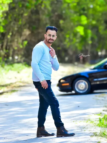 A full-length portrait with a car in the background, giving it a cool, modern vibe. This is a great example of a lifestyle portrait session.