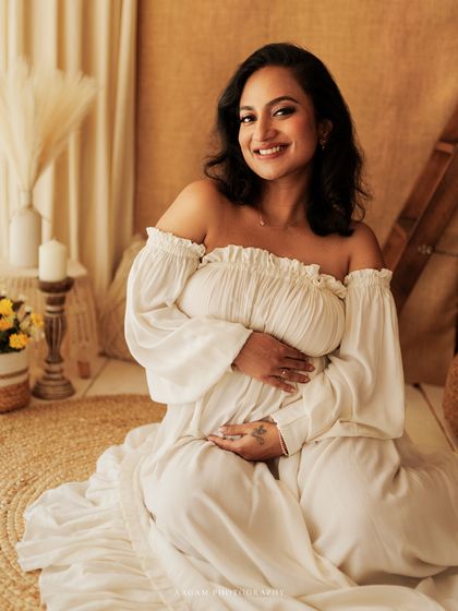 A serene and happy portrait, seated amongst the natural textures of the boho setup. This is perfect for the mom who wants a light and airy feel for her photos.