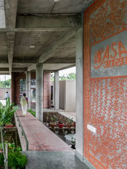 A large, intricate mural graces the wall at the entrance of the ASA office. The artwork, which incorporates the organization's name in Hindi, creates a strong sense of identity and place.