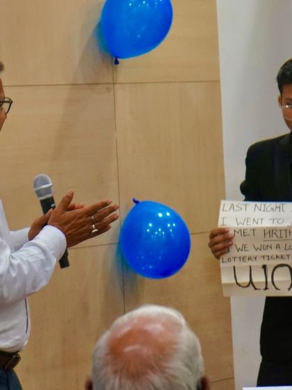 The reveal. Here I am showing my prediction, which matched the lottery number the director was thinking of. This is the power of mentalism.