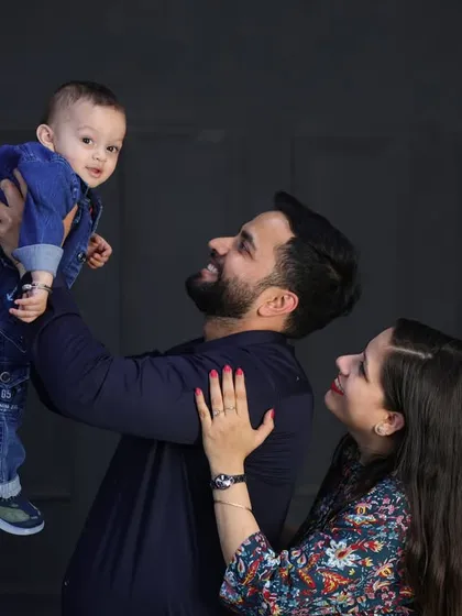 Capturing the pure joy of a father lifting his son. Even in a studio setting, I encourage playful interactions to get those genuine, happy expressions.