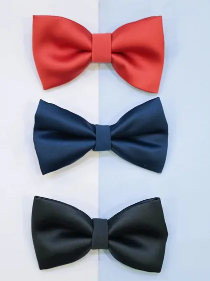 Our classic bows are perfect for any look. This image displays our simple yet elegant satin bow ties for men, available in essential colors like red, navy, and black.
