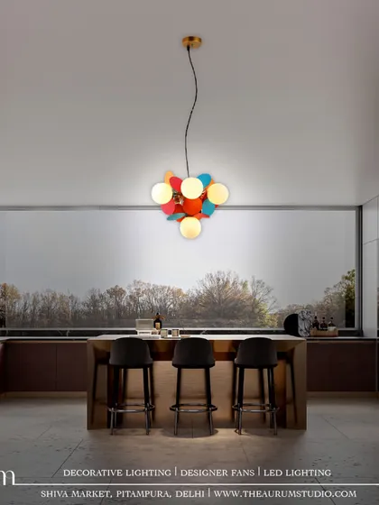This playful, multi-colored disc pendant adds a pop of color and personality to a modern kitchen. It’s a statement piece that proves luxury lighting can also be vibrant and fun.
