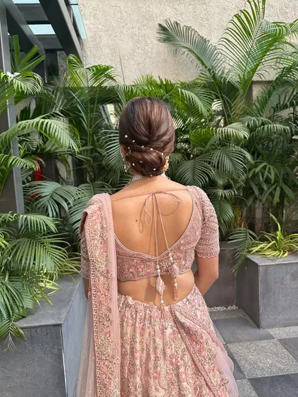 Another view of this dreamy, Pinterest-worthy bun. The texture and placement of the pearls create a look that is both modern and timeless.