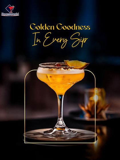 An elegant coupe glass holds this golden-hued cocktail, finished with a delicate garnish. Its shimmering appearance and refined presentation make it a perfect choice for upscale events.