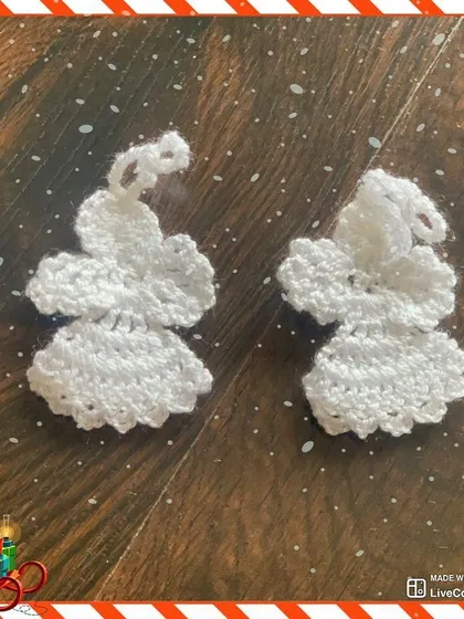 These delicate white angel ornaments are crocheted to look like they are in flight. They add a touch of elegance and tradition to your holiday decor.