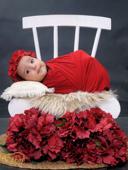 The same baby girl looking directly at the camera. It's rare to get such calm and direct eye contact from a newborn, making this shot extra special.