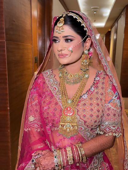 A side profile showing the intricate details of the jewelry and outfit. The makeup is kept clean and elegant to balance the overall look.