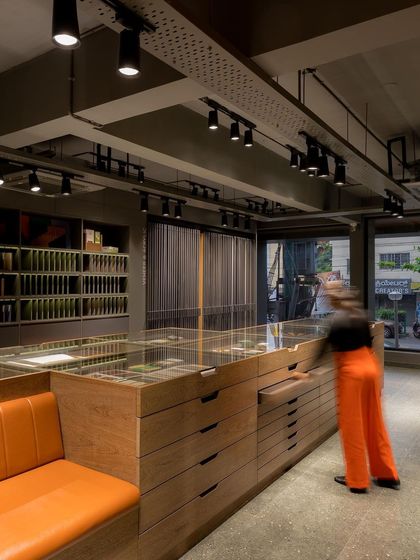 The showroom is designed for interaction, with every element encouraging clients to touch, feel, and explore the materials.