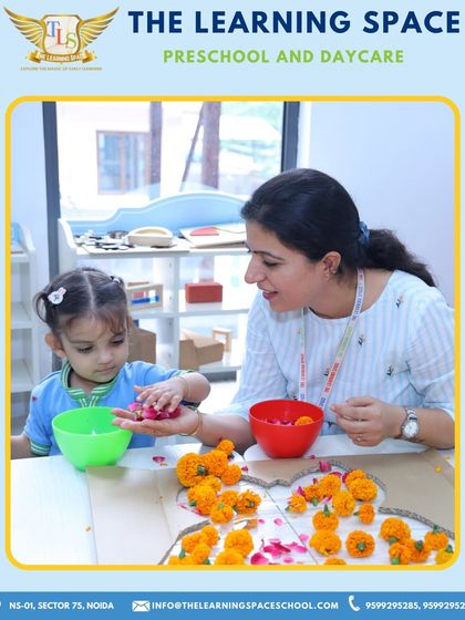 A teacher guides a child in a flower craft activity. Our educators are always on hand to support and encourage, ensuring each child feels confident in their creative abilities.