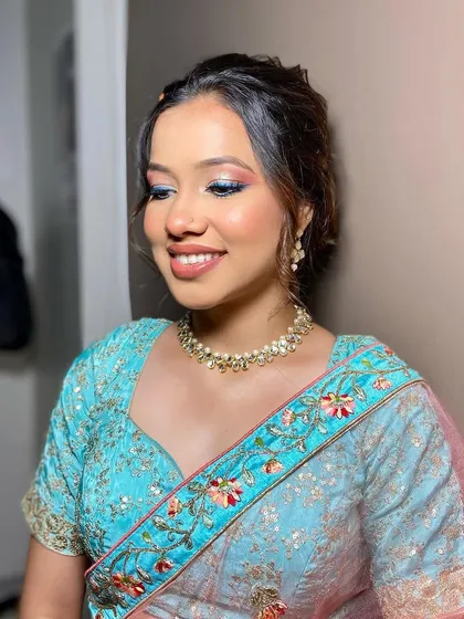 A beautiful look created for a makeup seminar. This style features a soft blend of pink and blue on the eyes, showcasing a creative and colorful approach to party makeup.