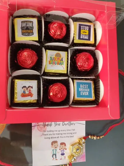 A box of 9 Rakhi chocolates, mixing personalized message chocolates with foil-wrapped ones, plus a rakhi and card.