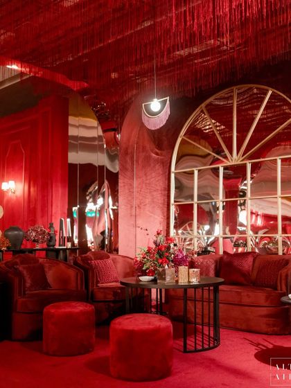Another view of the luxurious red velvet seating and distorted mirrors at 'Le Rouge'. The entire room was a contemporary boudoir burlesque scene we created from scratch.