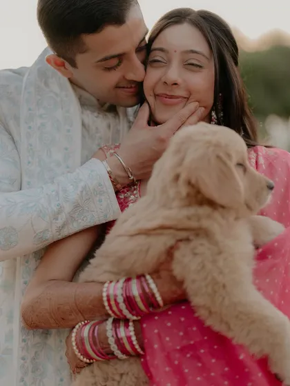 Pure happiness. This candid shot of Kajal and Ram playing with a golden retriever puppy is full of laughter and love, a perfect memory from their Jaisalmer wedding celebrations.