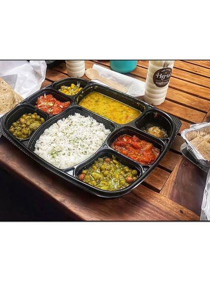 A happy customer shared this picture of their lunch, a complete thali with dal, rice, two sabzis, and other sides.