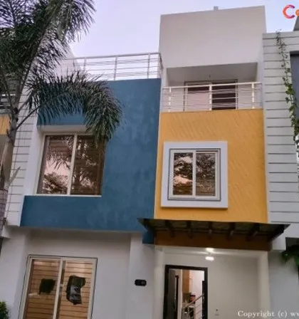 This modern villa's exterior was transformed with a durable, weather-resistant paint combination. We used a sophisticated palette of blue, yellow, and white to enhance the building's architectural features and provide long-lasting curb appeal.