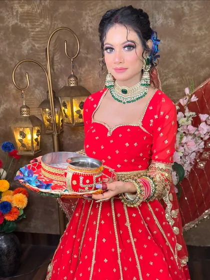 The perfect festive pose in my red lehenga. The blue flowers in the hair add a modern touch to this otherwise traditional Karwa Chauth look.