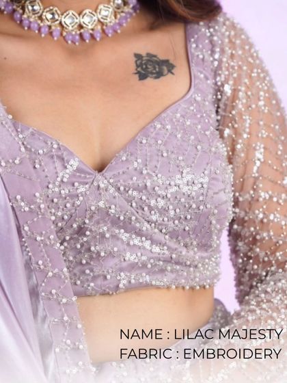 A close-up of a lilac majesty embroidered blouse, showing the beautiful texture and beadwork.