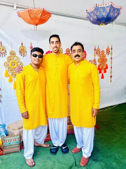 Happy clients celebrating a Haldi ceremony in our matching bright yellow kurtas. We love creating coordinated looks for the whole family to enjoy festive moments together.