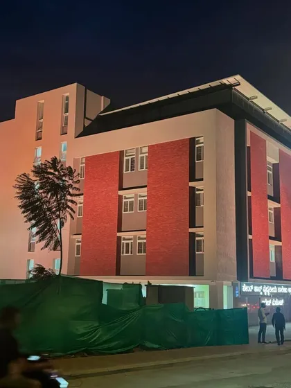 The completed St. John’s Hospital on Kanakpura Road, illuminated at night. This project showcases my capability in handling large-scale institutional architecture, blending modern functionality with a welcoming design aesthetic.