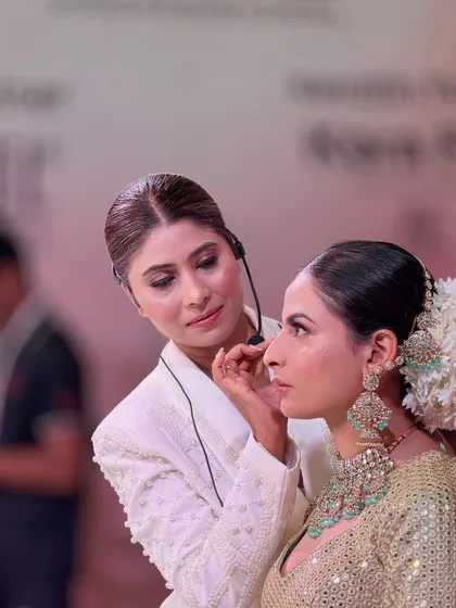 Creating magic on stage at the Delhi Beauty & Spa Expo. Here I am, focused on the details, demonstrating a bridal look to a live audience.