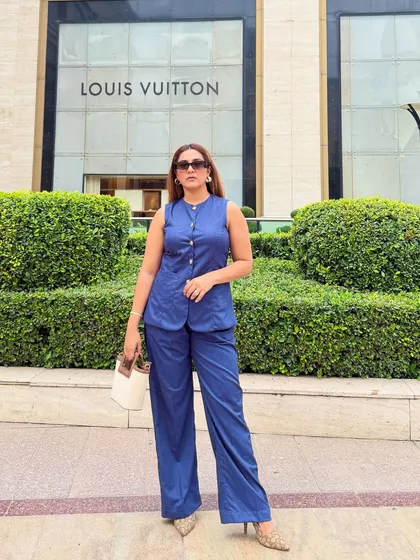 This full-length view shows how a well-fitted co-ord set can create a strong, cohesive look. The monochrome blue is both striking and professional, and pairing it with neutral accessories keeps the focus on the sharp tailoring.