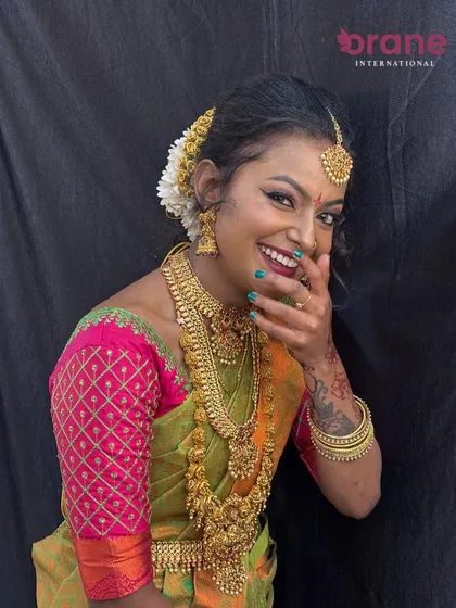 A candid, joyful moment captured after the bridal makeover is complete.