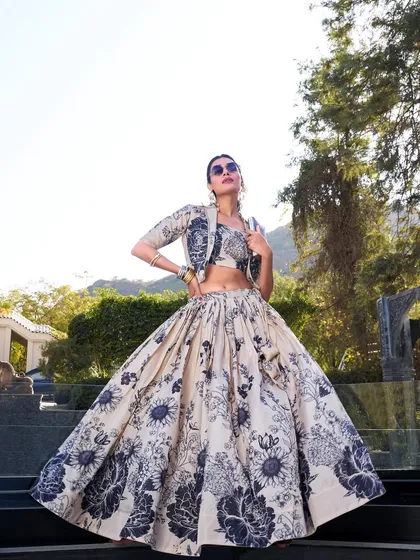 For a modern vibe with a traditional touch, I created this Tussar silk floral print lehenga. The jacket gives it a chic, Indo-Western feel, perfect for a brunch or a destination wedding event. It's elegance with a bit of an edge.