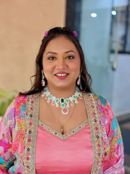 A happy, smiling shot of the bride, ready for her pre-wedding festivities.