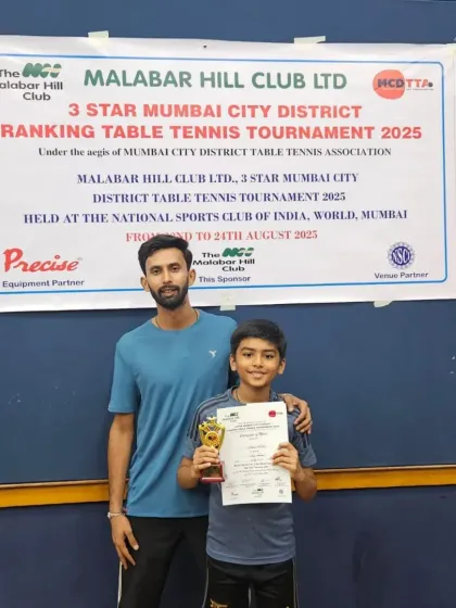 Another one of our promising young players with his coach and trophy at the Malabar Hill Club district tournament. This one-on-one encouragement is a key part of our coaching style.