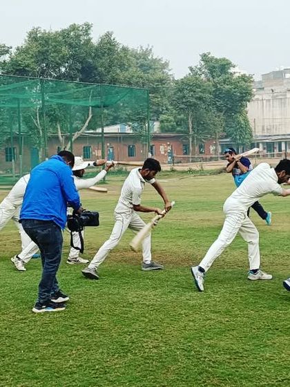 A coach demonstrates the correct technique for a drive, with students mirroring the action. This is how we build a strong technical foundation.