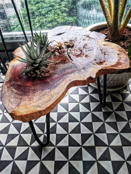 A quirky, custom-made coffee table we created with a live succulent planter built into a slice of wood. We love experimenting when clients give us the freedom.