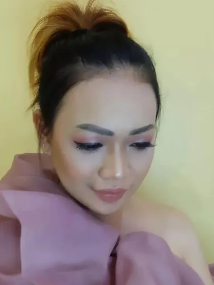 Another angle of this soft, artistic makeup look. The blending on the eyes and the subtle highlight on the skin create a gentle and romantic feel.
