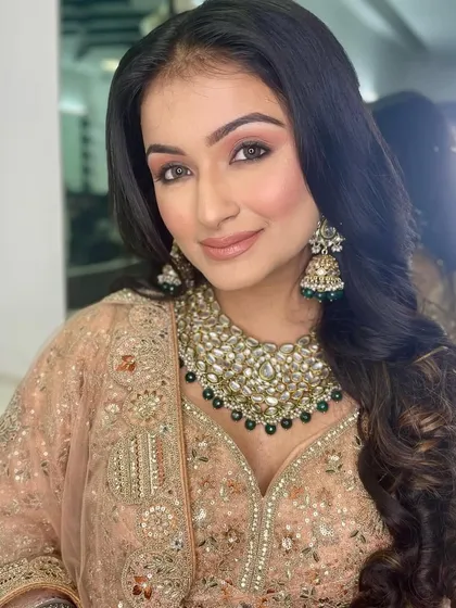This image showcases the beautiful, bouncy curls that complement the soft makeup. My hairstyling classes cover a range of techniques for creating voluminous hair.