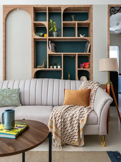 We design furniture that is both a statement piece and a reflection of your personality. This custom-built shelving unit acts as a stunning focal point in the living room, offering a unique way to display books and decor while adding architectural interest.
