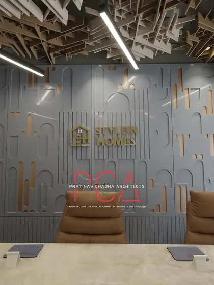 The conference room for the StyleIn Homes office project in New Delhi, featuring a custom-designed acoustic ceiling and a feature wall with the company's branding. This space was designed to be both functional and representative of the client's corporate identity, demonstrating my expertise in commercial interior design.