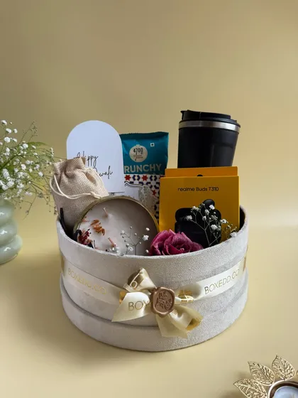 A full view of the luxurious round velvet box for Diwali. This hamper is a perfect example of how we combine tech gadgets, lifestyle products, and festive treats.