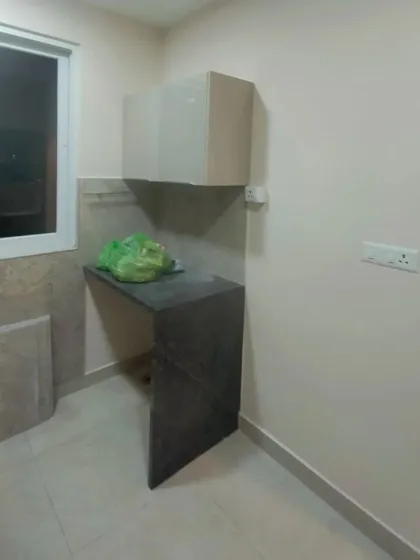A utility or kitchen area with newly painted walls. Even in functional spaces, a professional paint job makes a significant difference, making the area feel cleaner and more finished.